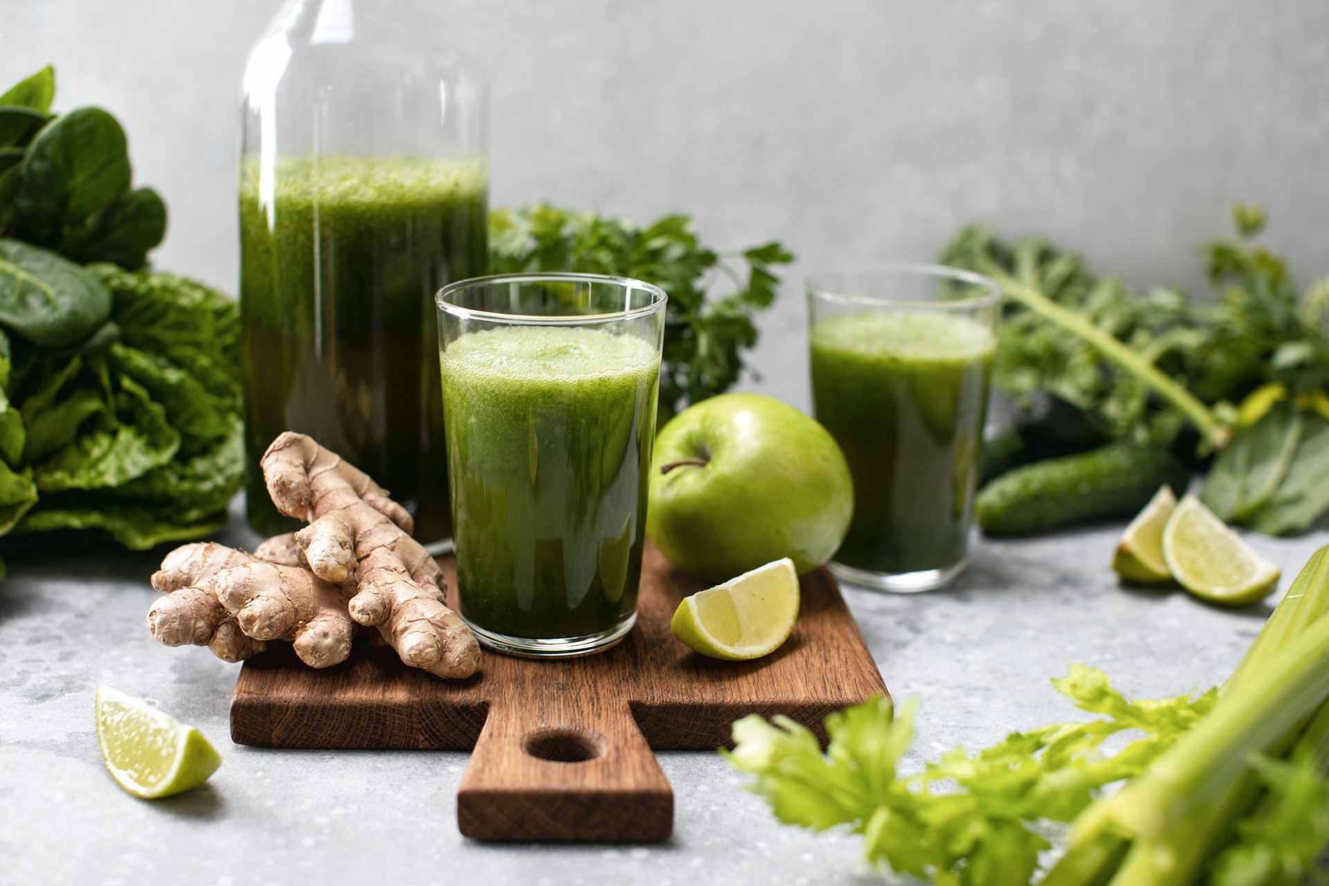 Green detox smoothies with fresh leafy vegetables and ginger